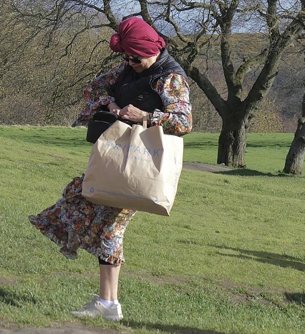 Person leaning back into a strong wind.