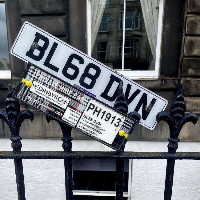 Number plate and private car-hire registration.